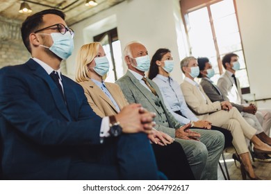 Audience With Protective Mask At The Conference Room.