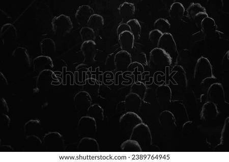 audience silhouette on black and white