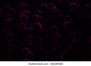 Audience Silhouette On Purple And Red Light