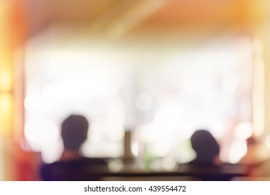 Audience in a theater, on a concert and applauding blurred, people sitting in a restaurant or cafe, unrecognizable blurry silhouettes with space for text - Powered by Shutterstock