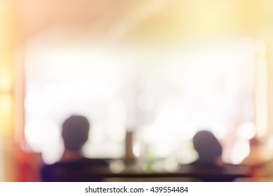 Audience in a theater, on a concert and applauding blurred, people sitting in a restaurant or cafe, unrecognizable blurry silhouettes with space for text - Powered by Shutterstock