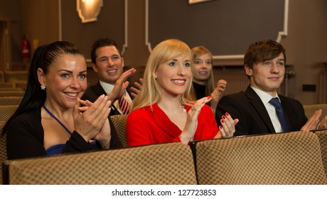 Audience In A Theater, On A Concert Or In A Cinema Clapping And Applauding