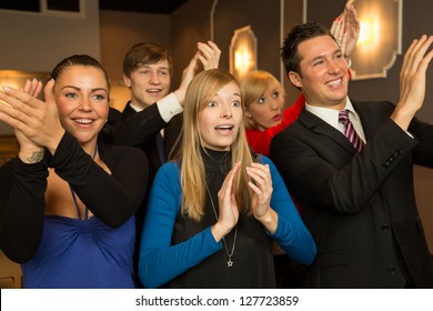 Audience In A Theater, On A Concert Or In A Cinema Clapping And Applauding