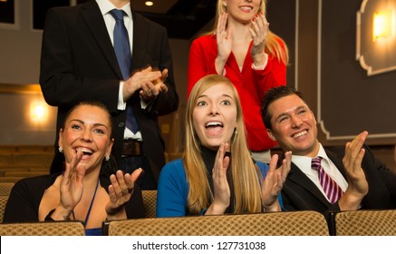 Audience In A Theater, On A Concert Or In A Cinema Clapping And Applauding