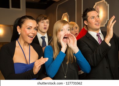 Audience In A Theater, On A Concert Or In A Cinema Clapping And Applauding