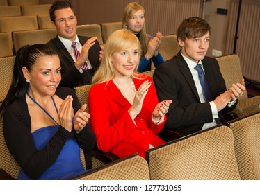 Audience In A Theater, On A Concert Or In A Cinema Clapping And Applauding