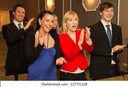 Audience In A Theater, On A Concert Or In A Cinema Clapping And Applauding