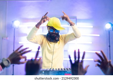 Audience Waving Hand For Dj Player Music At Music Concert - Concept Of Nightclub, Entertainment And Hip Hop Rapper