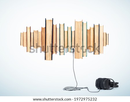 Audio books concept, sound wave from paper books, headphones connected below. On light blue background