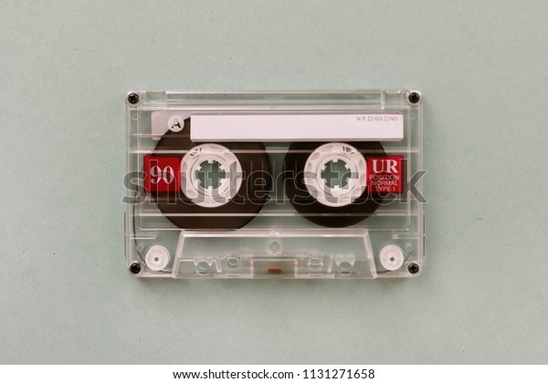 Audio cassette - analogue audio storage media.\
Audio cassette on gray\
background