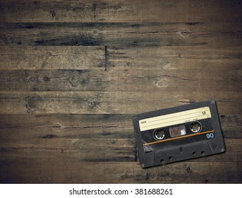 Audio Cassette On Brown Wood. Hip Hop