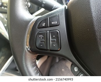 Audio control buttons on the steering wheel of a modern car, multifunction buttons for quick control phone, music and other function on the steering