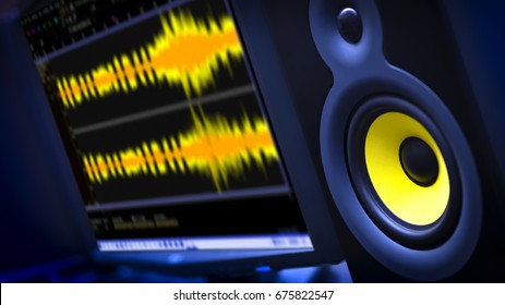 Audio Editing Computer With Studio Monitor Speaker And Waveform Displayed On Monitor.  Shallow Depth Of Field With Focus On Speaker.