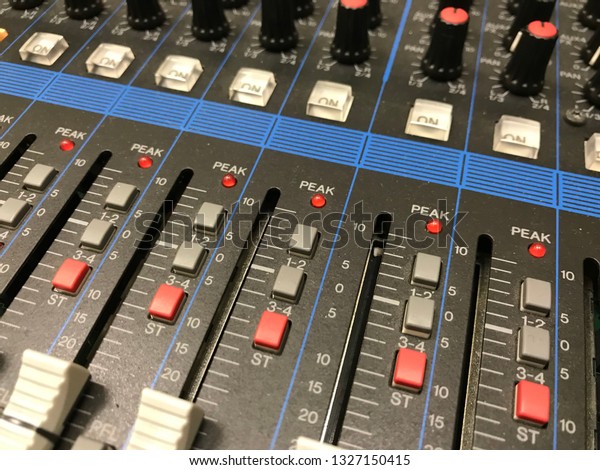 The audio equipment, control
panel of digital studio mixer, front view. Close-up, selected
focus