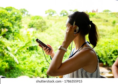 Audio Guide Learning History. Asian Woman Listening Landmark Of Local Area For Study With Guide Radio MP3.