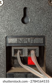 Audio input panel with connected cables on professional sound equipment surface
