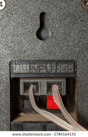Audio input panel with connected cables on professional sound equipment surface