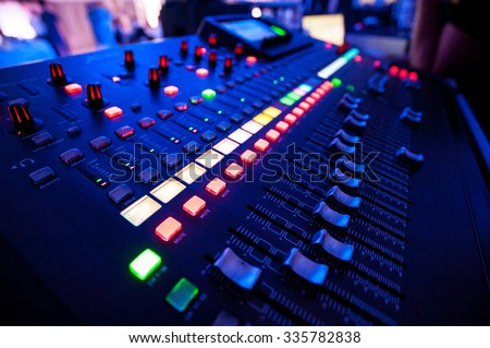 Audio mixer and microphone. Close-up of the Mixing console. mixing knobs.