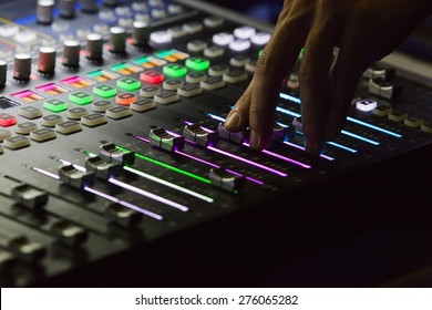 Audio mixer mixing board fader and knobs, Music mixing console with backlit buttons