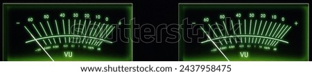 Audio Network Streamer, DAC, and Amplifier Dual Volume Unit Meters Glowing in the Dark.