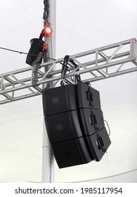 Audio Sound System Speakers Hanging From Metal Structure Under A Tent
