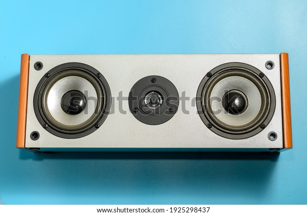 Audio speakers on blue background. The musical\
equipment. Close-up