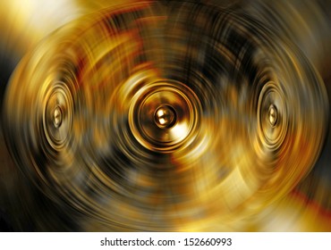 Audio speakers on a swirling gold background