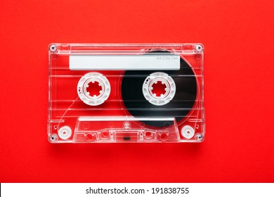 Audio tape cassette on red background