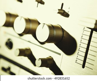 Audio volume regulators knobs of sound mixing controller. Professional DJ equipment. Old analog sound mixer console. Close up.