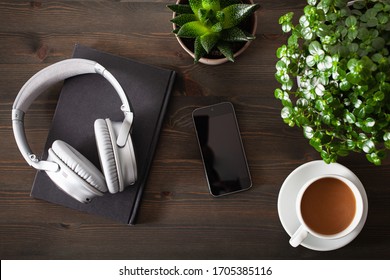 audiobook concept modern wireless headphones smartphone book