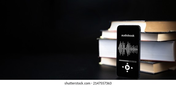 Audiobook Education. Smartphone Screen With Audiobook Application On Paper Books Black Background. Ebook E Learning Electronic Internet Mobility Concept