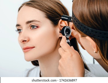 Audiologist Doctor Doing An Ear Exam With An Otoscope To A Patient Woman. Audiology. Hearing Test