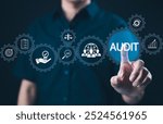 Audit business concept. Businessman interacts with word "AUDIT" and business icons. Check to examine accounting and finance of business, Evaluation, and examination financial, standard certification,