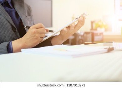 Audit checklist on document board, business working with paper.