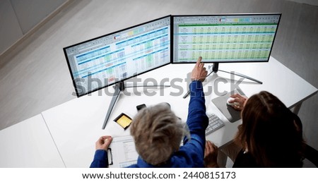Auditor Employees And Data Analyst Using Computer Spreadsheet