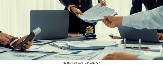 Auditor team collaborate in office, analyzing financial data and accounting record. Expertise in finance and taxation with accurate report and planning for company revenue, expense and budget. Insight - Shutterstock ID 2346902797