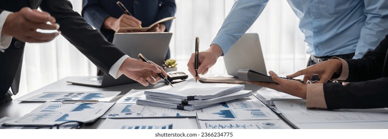 Auditor team collaborate in office, analyzing financial data and accounting record. Expertise in finance and taxation with accurate report and planning for company revenue, expense and budget. Insight - Shutterstock ID 2366234775