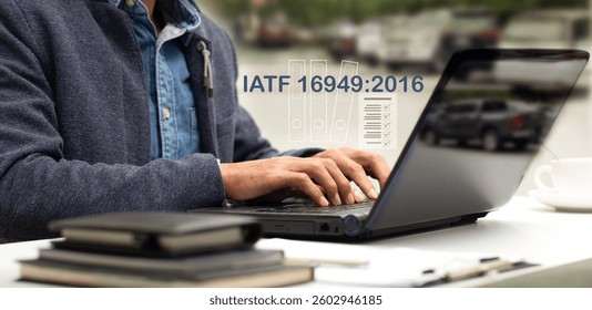 Auditor workwith laptop and checklist document IATF 16949:2016 at office desk, Automotive Quality Management System