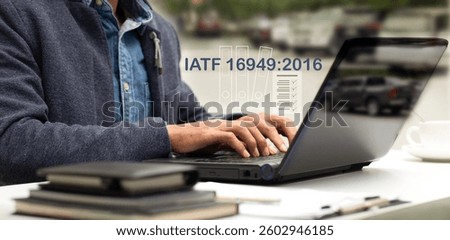 Auditor workwith laptop and checklist document IATF 16949:2016 at office desk, Automotive Quality Management System