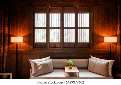 AUG 18, 2011Hangzhou, China : Contemporary Chinese Style Living Room Interior Decoration In Old Chinese Wooden House With Warm Light, Beige Colour Sofs Couch And Lamp