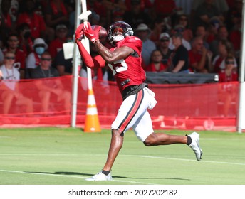 Aug 18, 2021; Tampa, FL USA;  Tampa Bay Buccaneers wide receiver Cyril Grayson (15) catches a pass from Tom Brady (12) during NFL training camp.