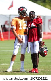 Aug 18, 2021; Tampa, FL USA;  Tampa Bay Buccaneers Quarterback Tom Brady (12) And Wide Receiver Chris Godwin (14) Share A Moment And Talk During NFL Training Camp.