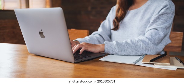 Aug 2nd 2021 : A Woman Using And Working On Apple MacBook Pro Laptop Computer, Chiang Mai Thailand