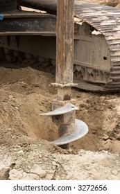 Auger At A Construction Site Digging A Hole For A Building.