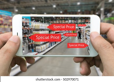 Augmented Reality Marketing Concept. Hand Holding Smart Phone Use AR Application To Check Special Price In Retail Store And Wholesale Market