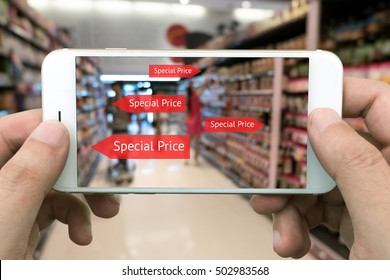 Augmented Reality Marketing Concept. Hand Holding Smart Phone Use AR Application To Check Special Price In Retail Store