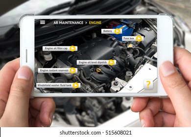 Augmented Reality Marketing Concept. Hand Holding Smart Phone Use AR Application To Check Maintenance Car Engine For Customer.