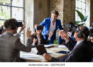 Augmented reality session in a business meeting run by an experienced technician, working group that uses new technological tools to optimize business and finance - Powered by Shutterstock