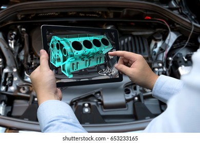 Augmented Reality Technology And Engineering Marketing Concept. Hand Holding Tablet With AR Service Application To Rotate 3d Rendering Of Energy Block 360 Degrees With Blur Car Engine Room Background