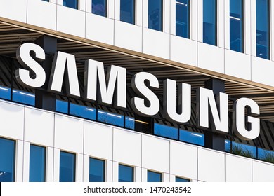 August 1, 2019 San Jose / CA / USA - Samsung Sign displayed on the facade of the modern HQ of Samsung Electronics Device Solutions America in Silicon Valley; subsidiary of Samsung Electronics, Ltd